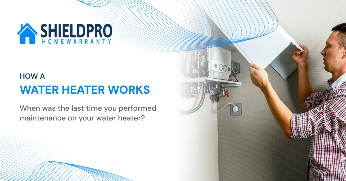 Technician performing annual water heater maintenance by draining sediment from tank for better performance